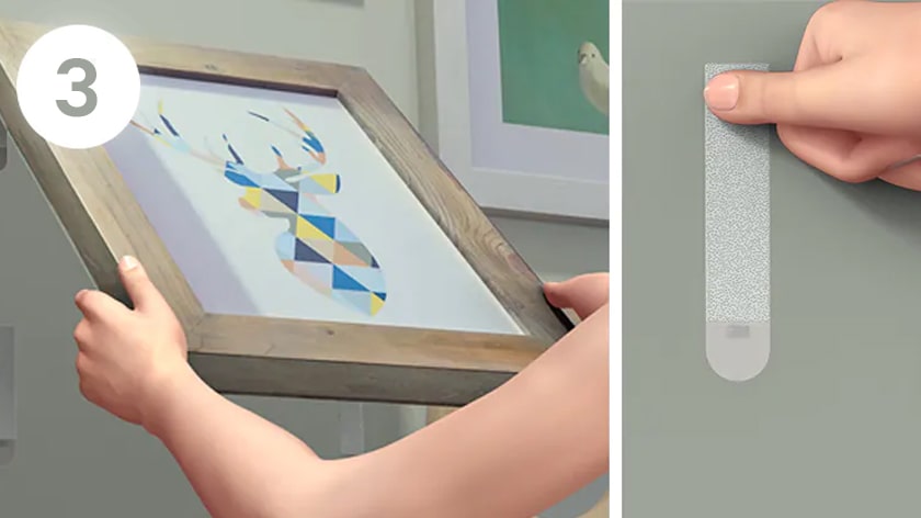 Dán khung tranh lên tường, ấn và giữ chiếc khung tranh để cố định